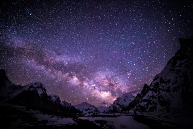 an image of the milky way among the mountains